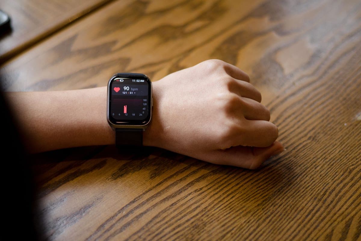 A smartwatch displaying a heart-rate reading