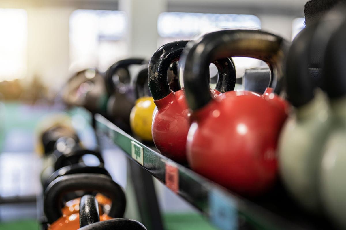 Cast-iron kettlebells lined up by weight