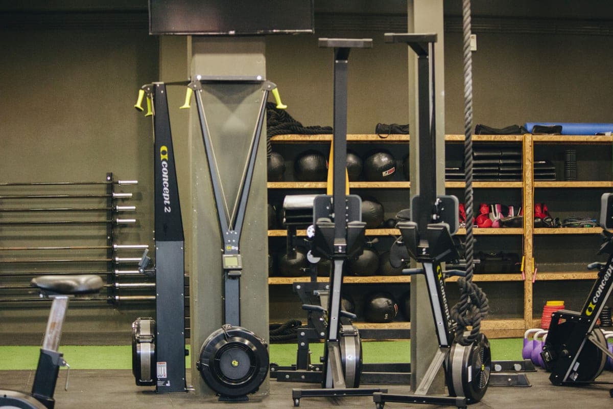A rowing machine on a wooden floor