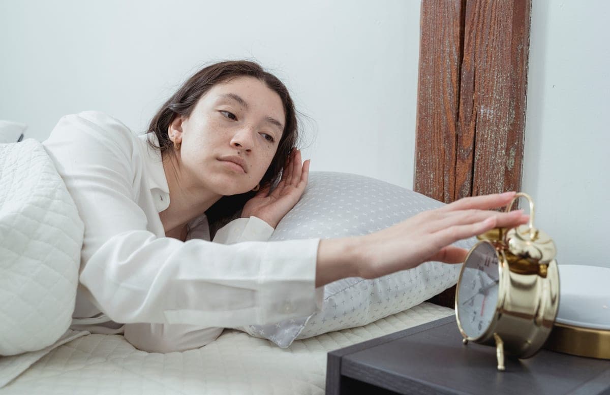 A wearable sleep tracker on a nightstand at night