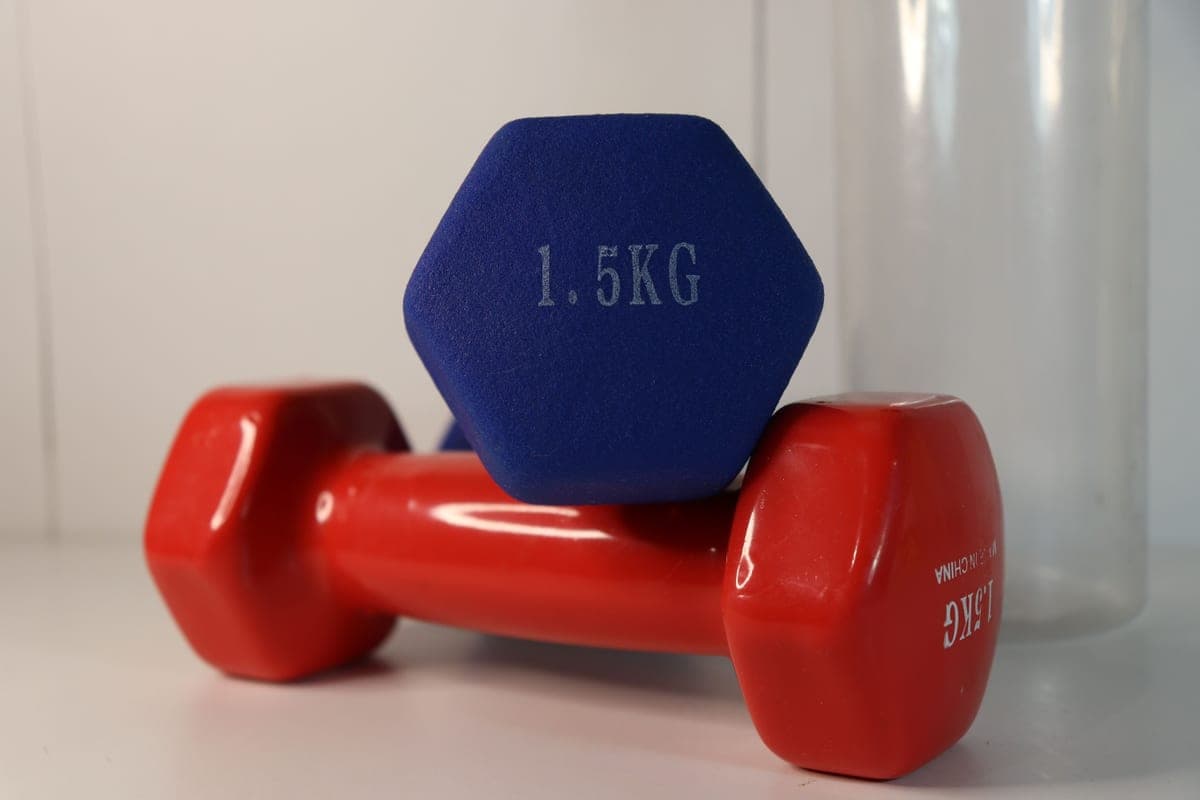 Compact fitness gear stored in a corner of a small apartment