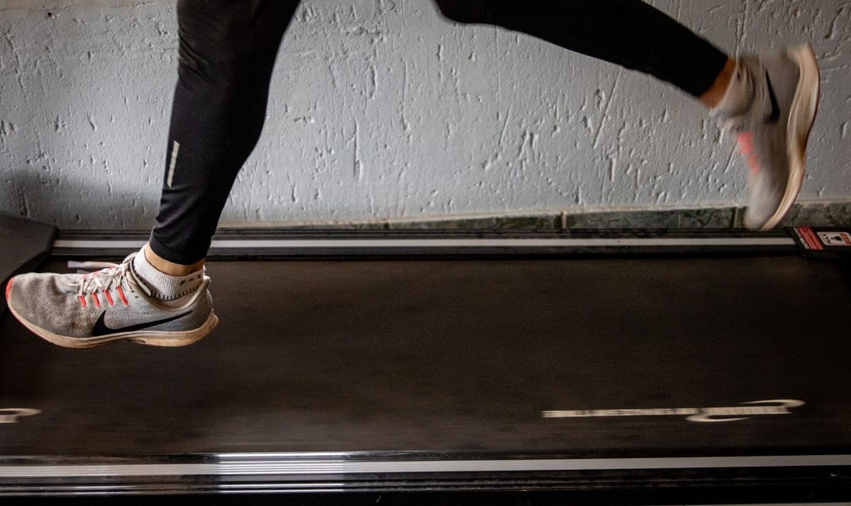 A folding treadmill in a home workout space